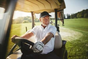 Senior man enjoying a game of golf after getting his cataracts addressed