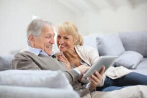 60-year-old couple enjoys spending time together on the couch